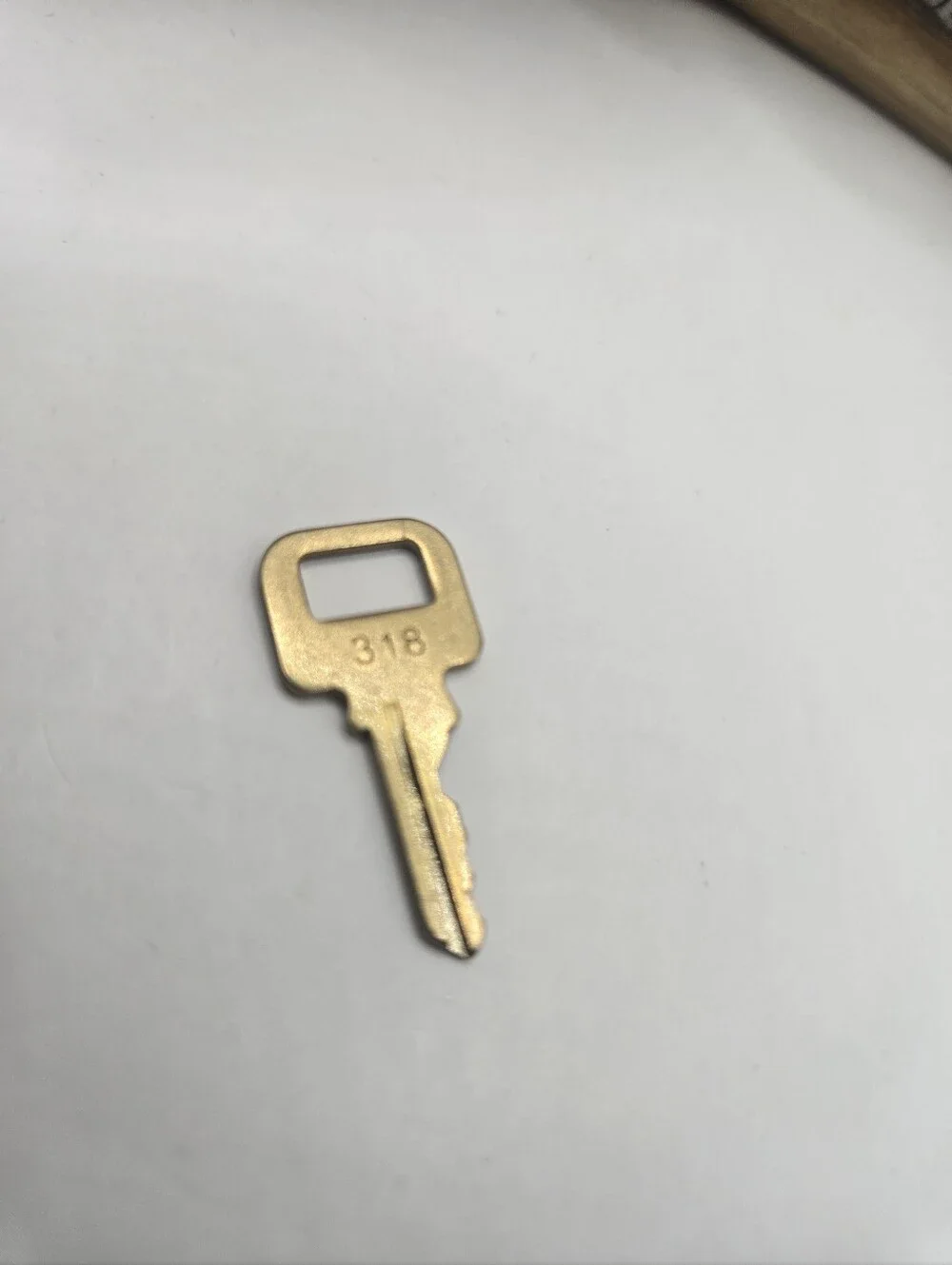Louis Vuitton Key '318'  Gold Tone
